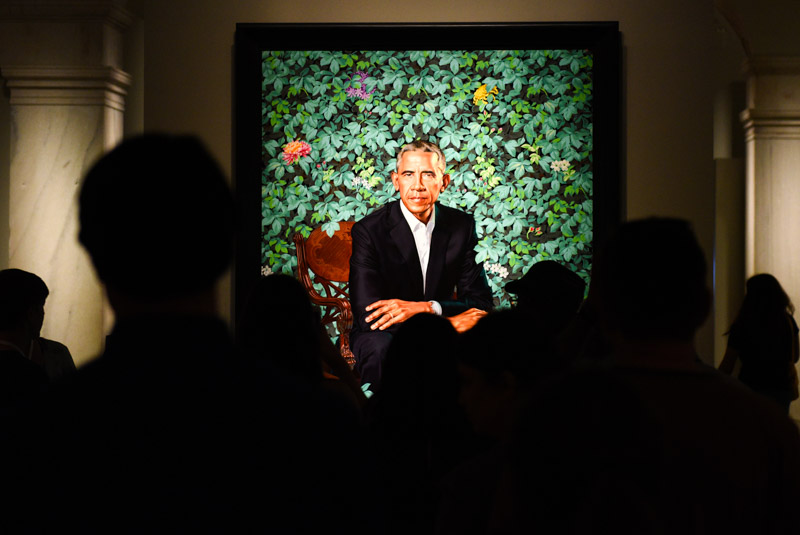 People near the portrait of the 44th president of the United States Barack Obama by Kehinde Wiley in National Portrait Gallery in DC.