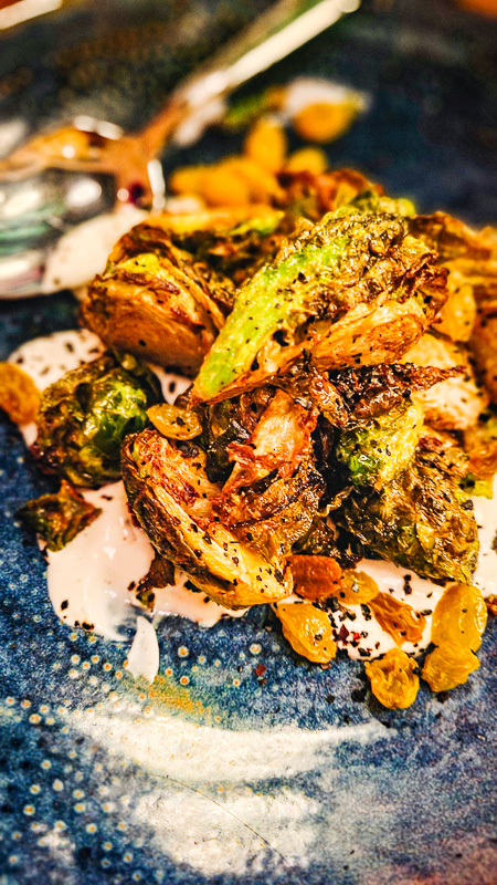 plate of brussel sprouts on lemon yoghurt