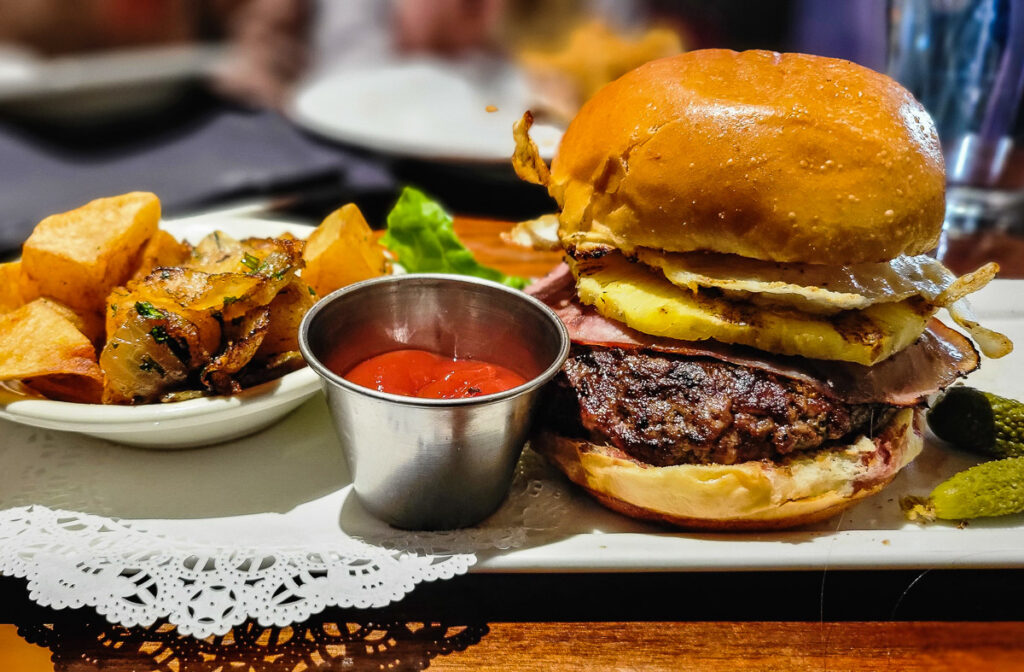 Burger, ketchup and potatoes on a plate