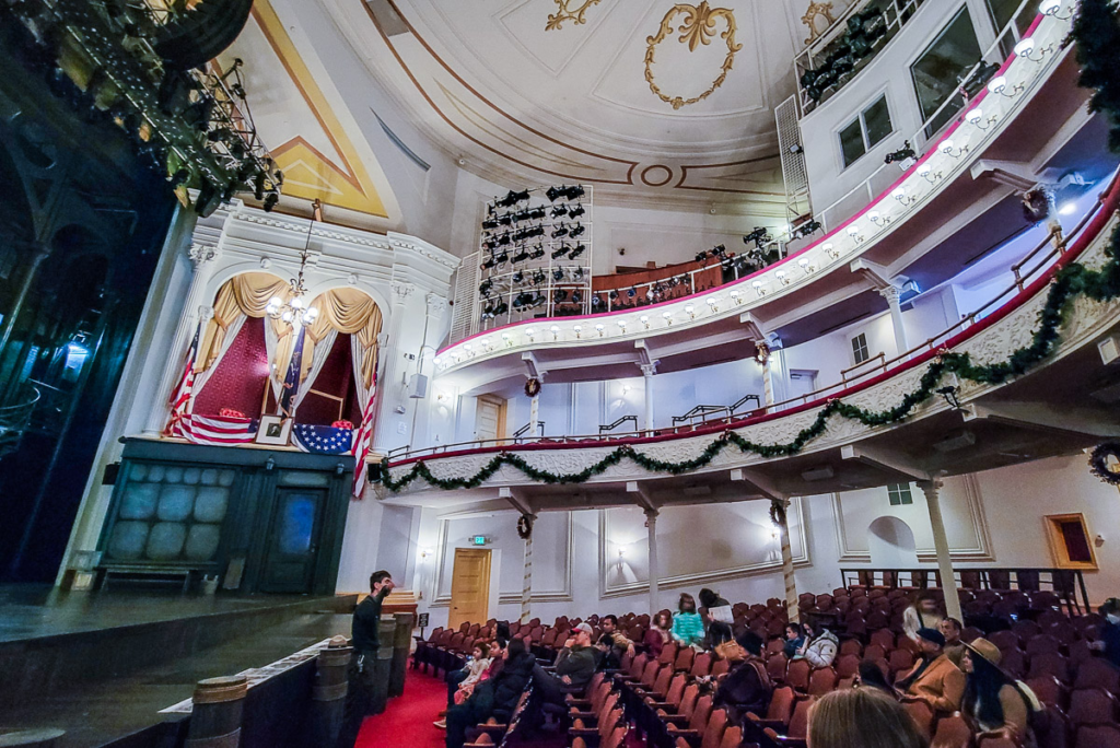 people listening to a tour inside ford's theater 