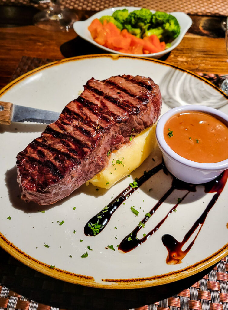 Steak and potato on a plate