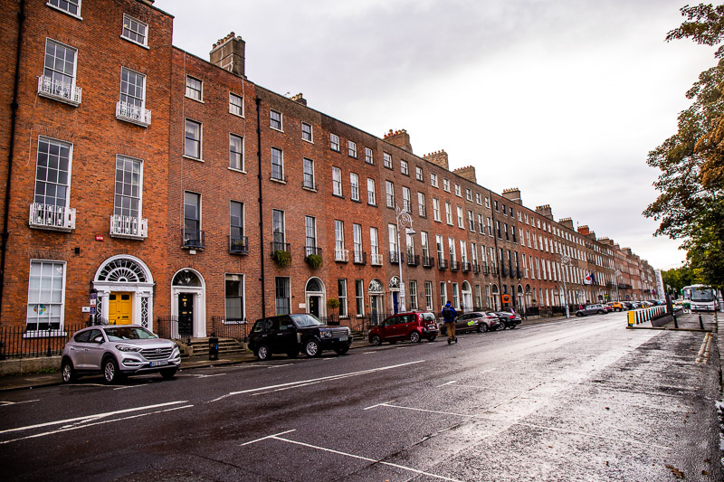 Row of townhomes around a city square