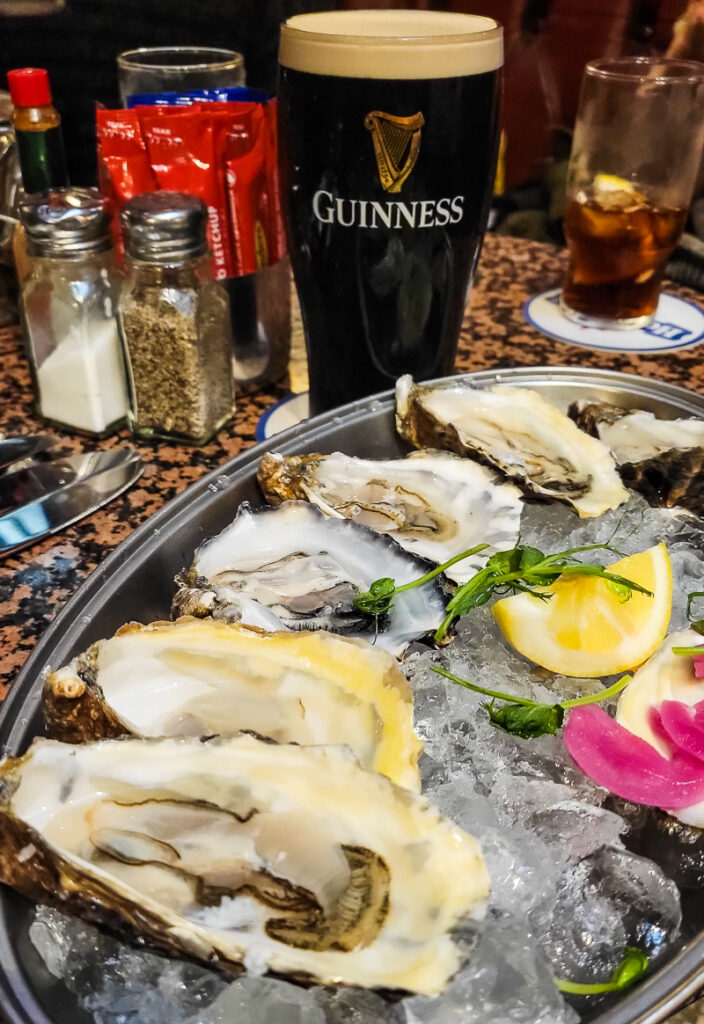 Plate of oysters and glass of Guinness beer