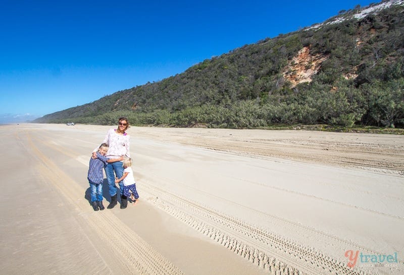 people standing on the beach