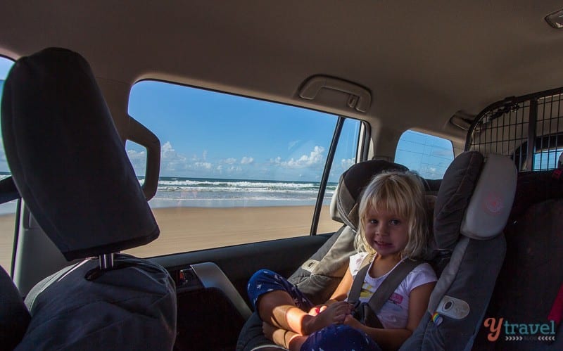 girl sitting in a car seat