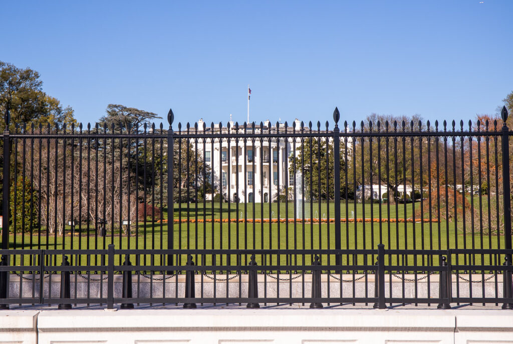 Large black metal fence surrounding the White House