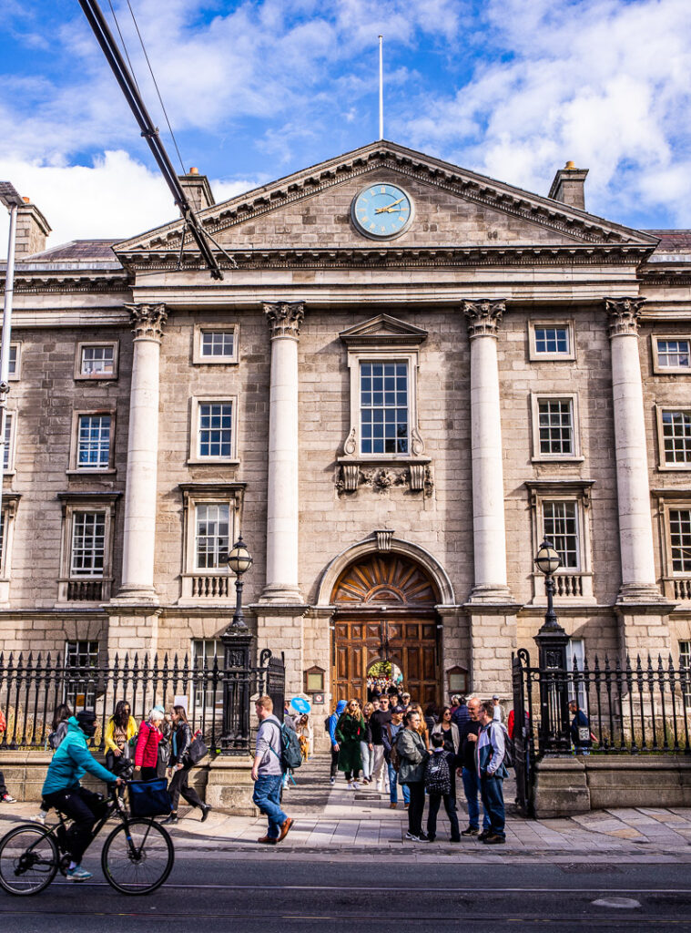 Students outside of the entrance gate to Trinity College in Dublin