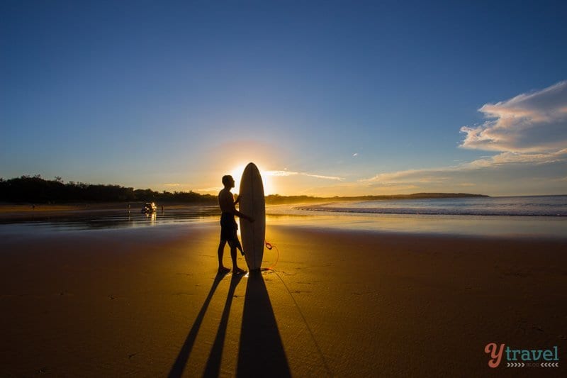 Surfer at Agnes Water Beach, Queensland, Australia