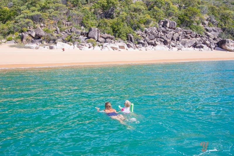 people swimming in the beach