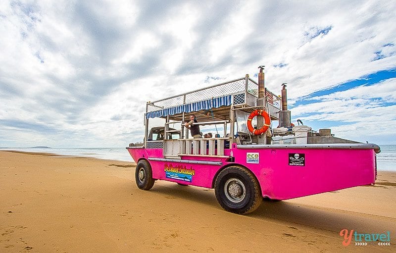 pink Larc vehicle on sand