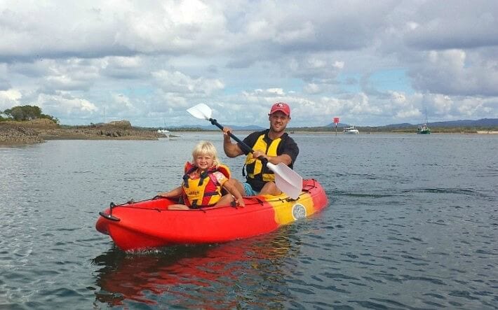 man and child Kayaking in the Town of 1770