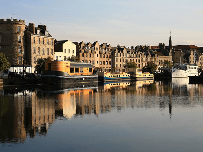 homes and boats line the river