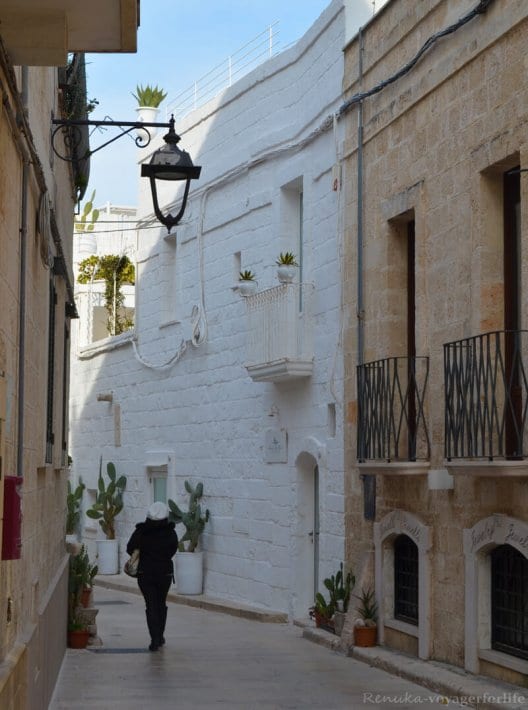 woman walking down alleyway