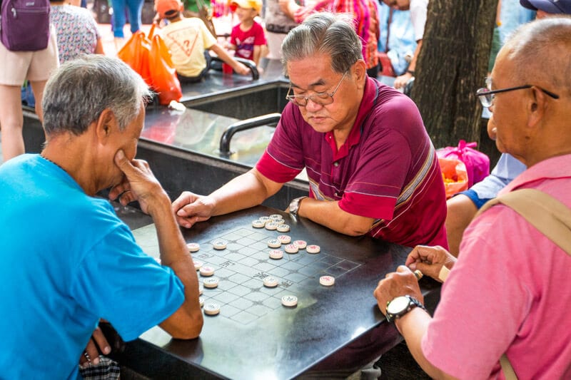 men playing checkers on table