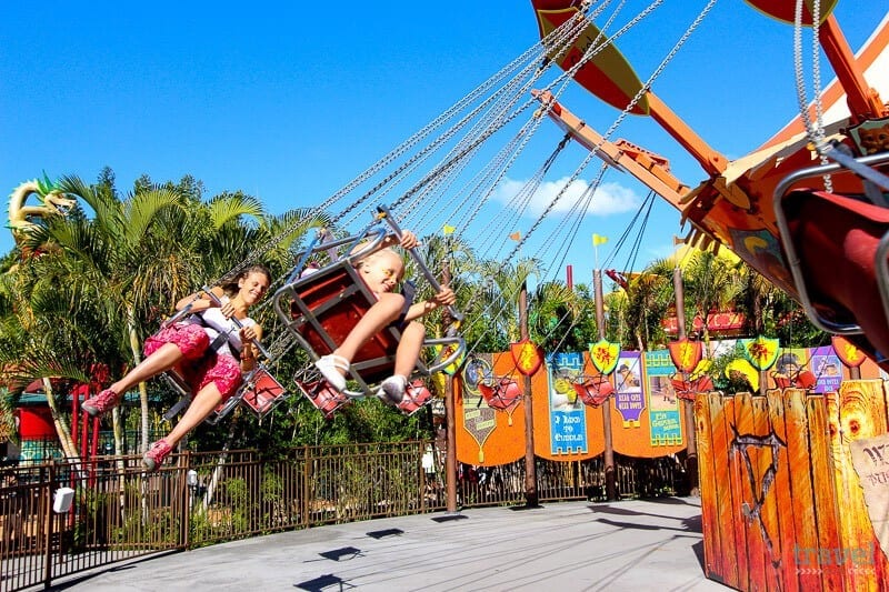 kids on swinging chair ride