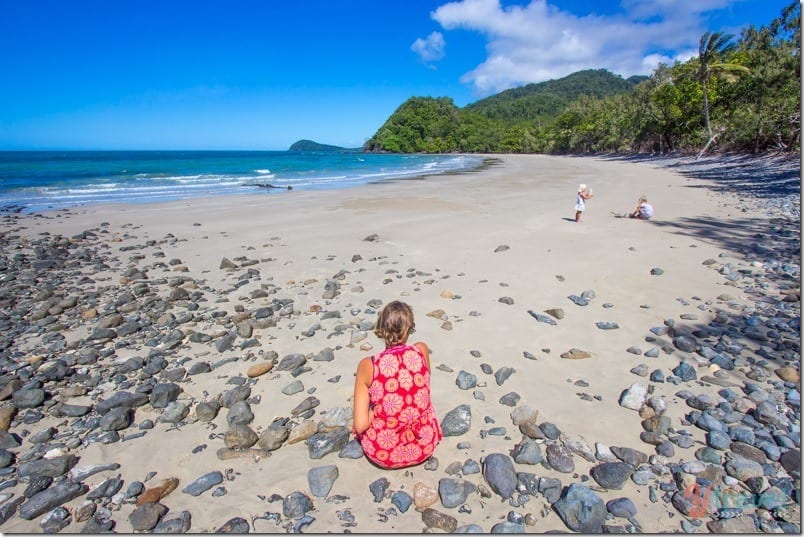 woman sitting on Emmagen Beach Daintree Rainforest