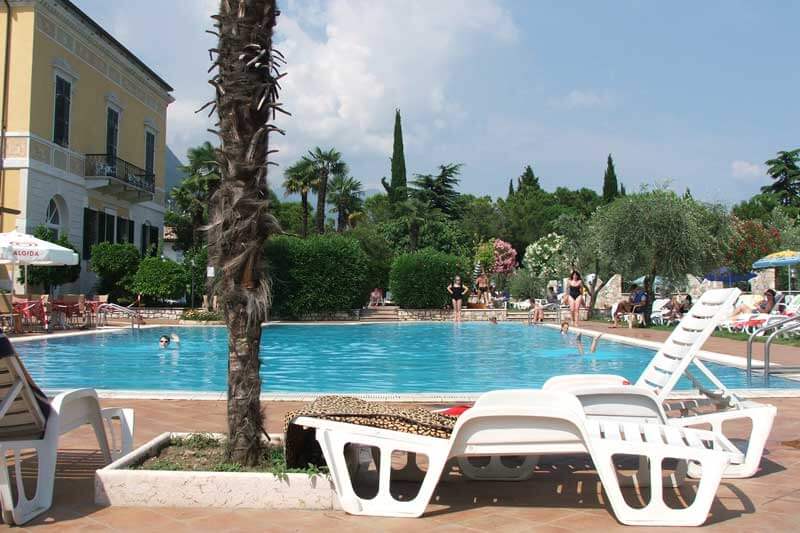 lounge chair by swimming pool