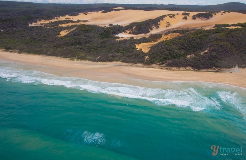 aerial view of green watera nd orange sand dunes of 75 mile beach Fraser Island, 