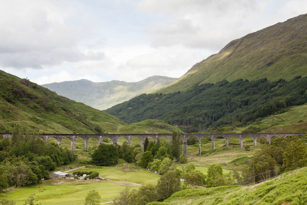 railway bridge across the green valley and foothills