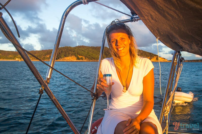 woman drinking champagne on boat