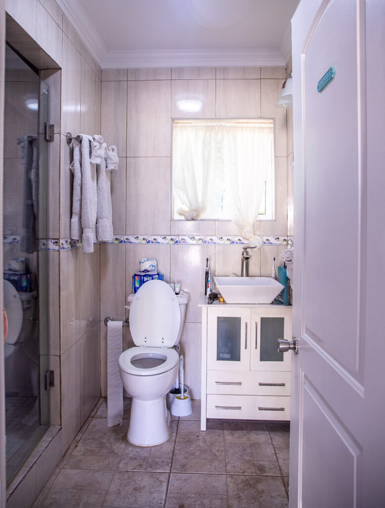 Toilet in a white bathroom