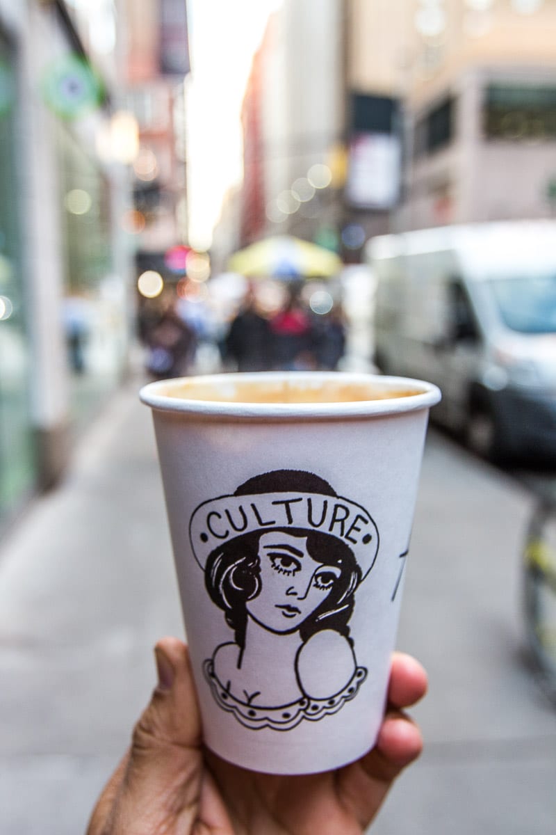 man holding coffee cup from Culture Espresso