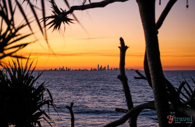 Sunset at Snapper Rocks with skyline sillouhete in distance