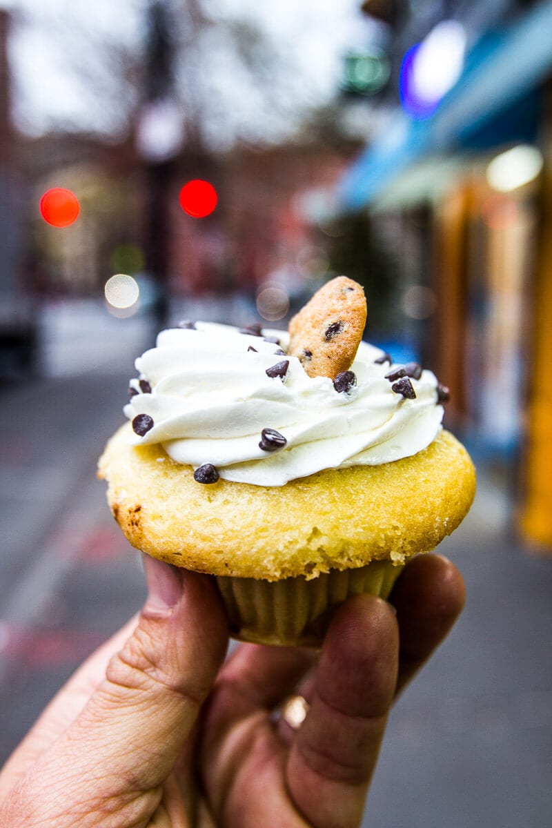 person holding a cupcake