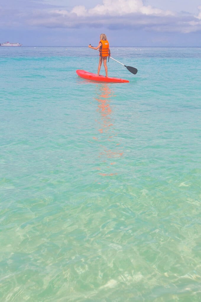 girl on stad up paddleboard on Punta Bunga Beach on Boracay 