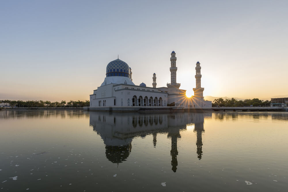 mosque floating on water at sunset