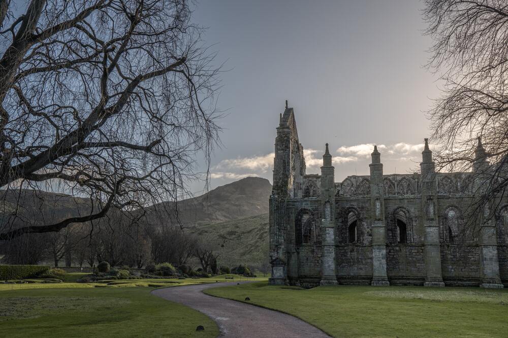 path winding up to grey stoned abbey