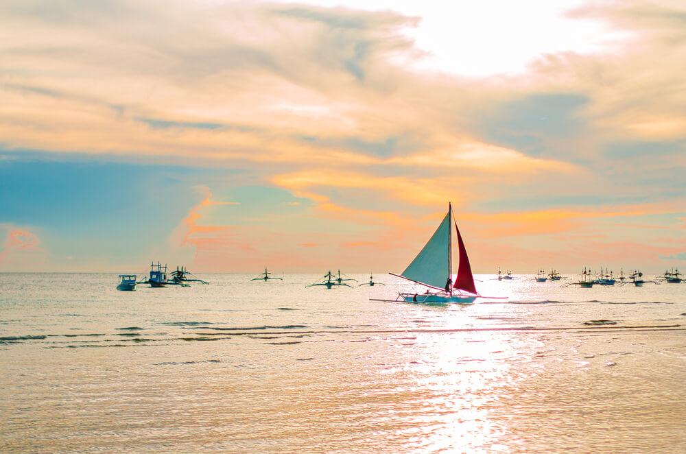 paraw sailboats on water