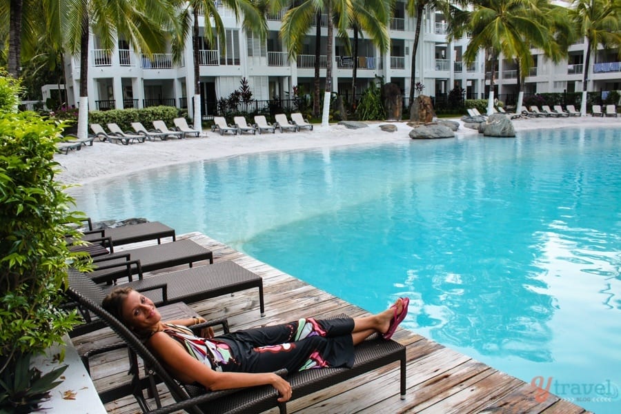 woman on lounge chair beside pool