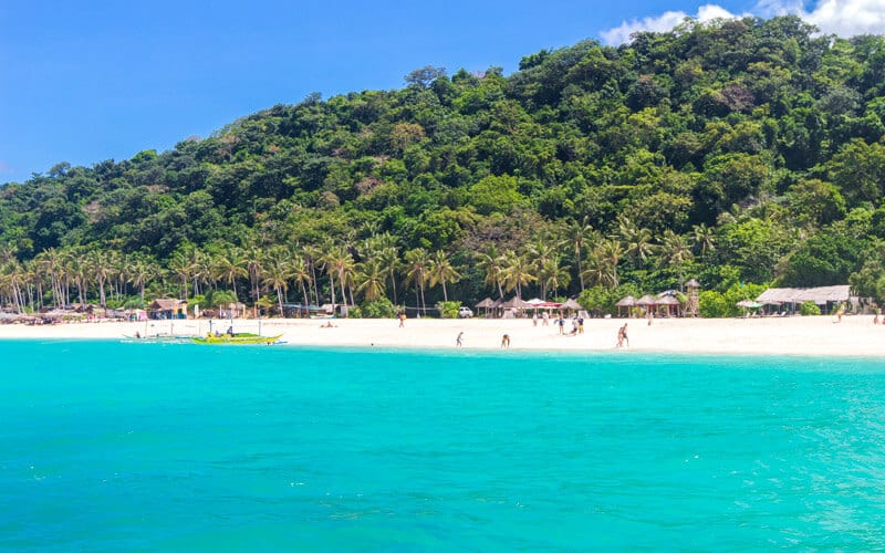 white sand, palm trees and aqua water of Puka Beach i