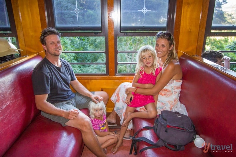 people sitting in a train compartment 