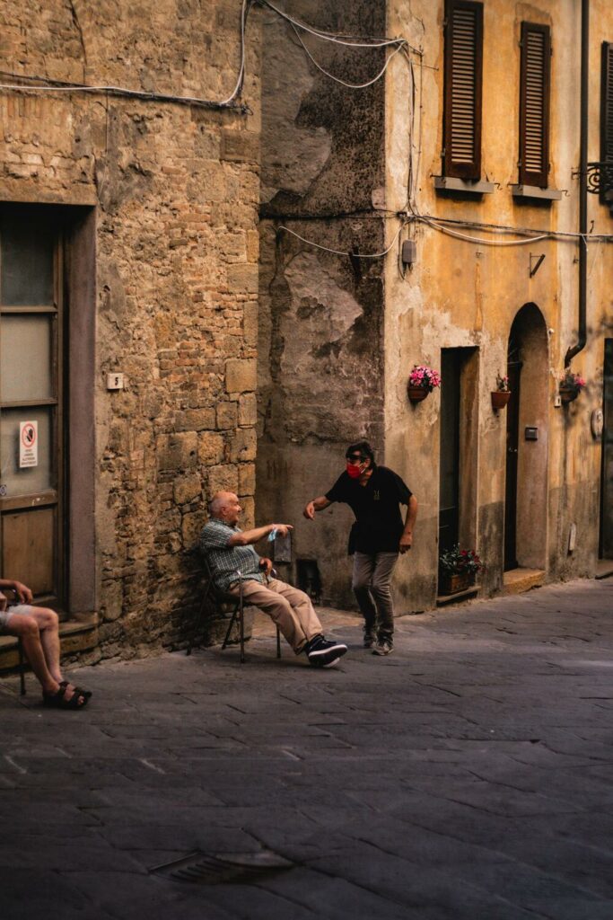 people sitting in an alleyway