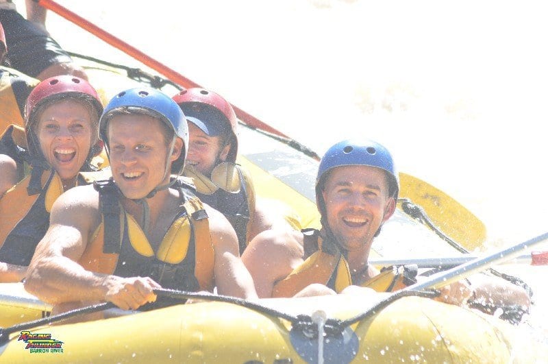 people laughing in White water rafting 