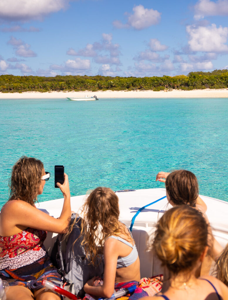 Mom and two kids on a boat ride