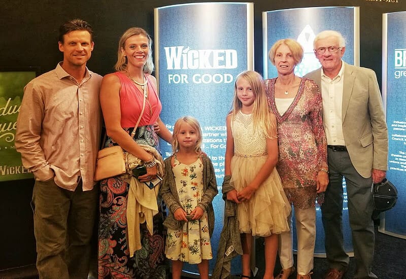 family posing for camera On Broadway