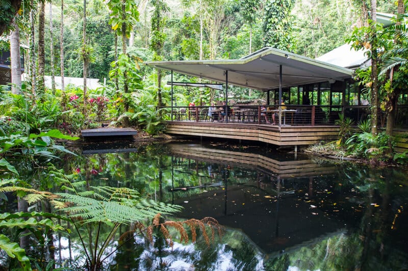 open air restaurant by a pond