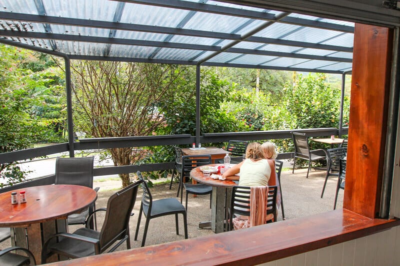 people on patio of Daintree River Hotel, eating