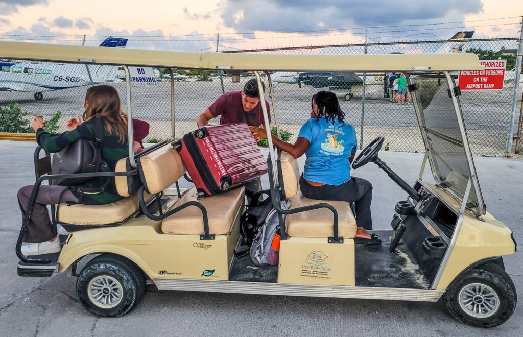 People sitting in a golf cart