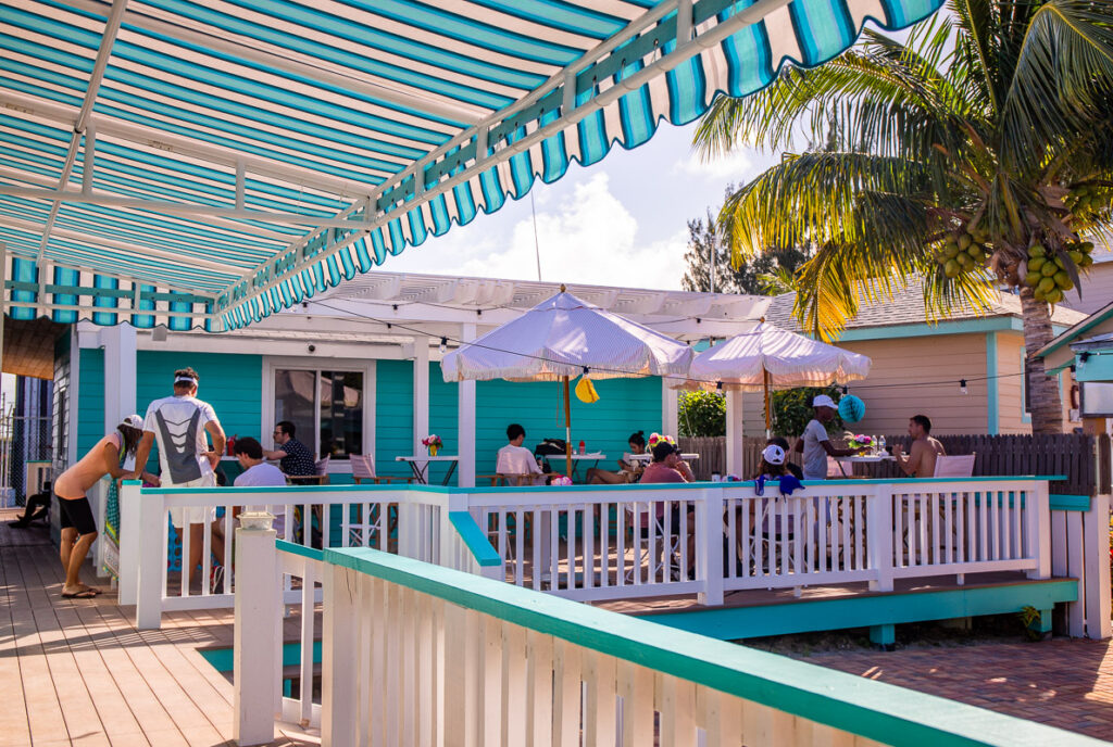 People sitting on a deck at a cafe