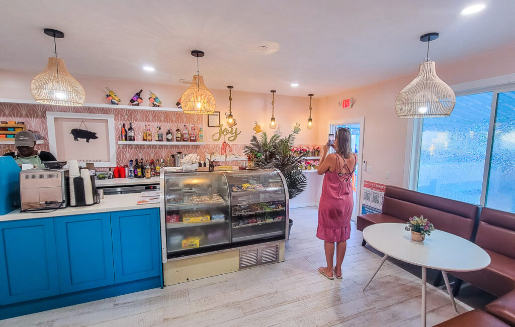 Lady standing inside a cafe