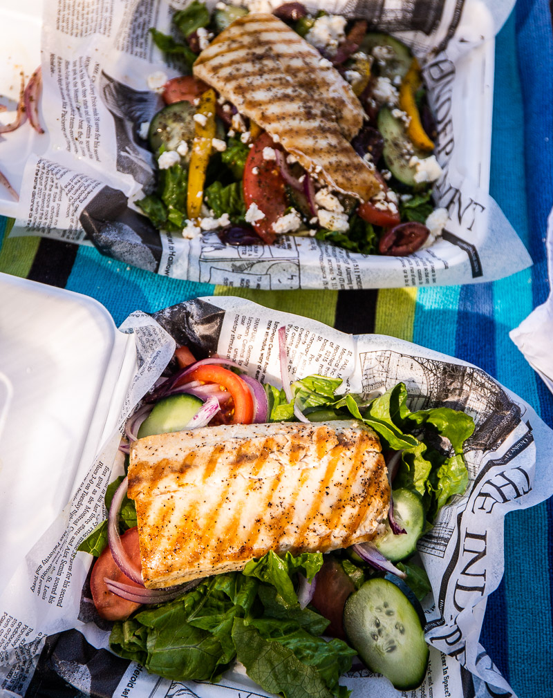 White fish on top of a salad