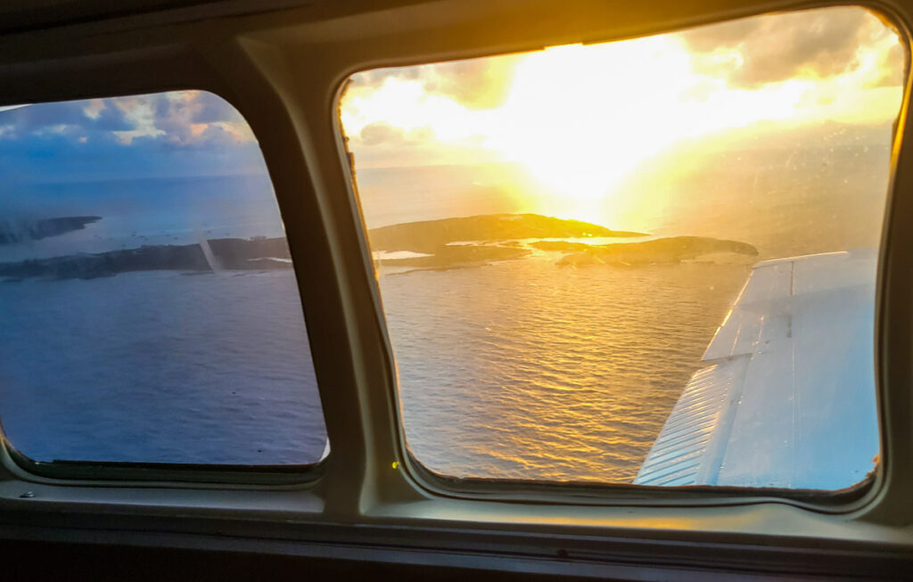 Sunset view from a window of a plane