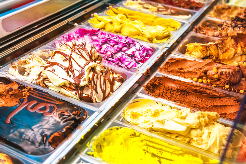 Many boxes of Italian ice cream gelato in a shop