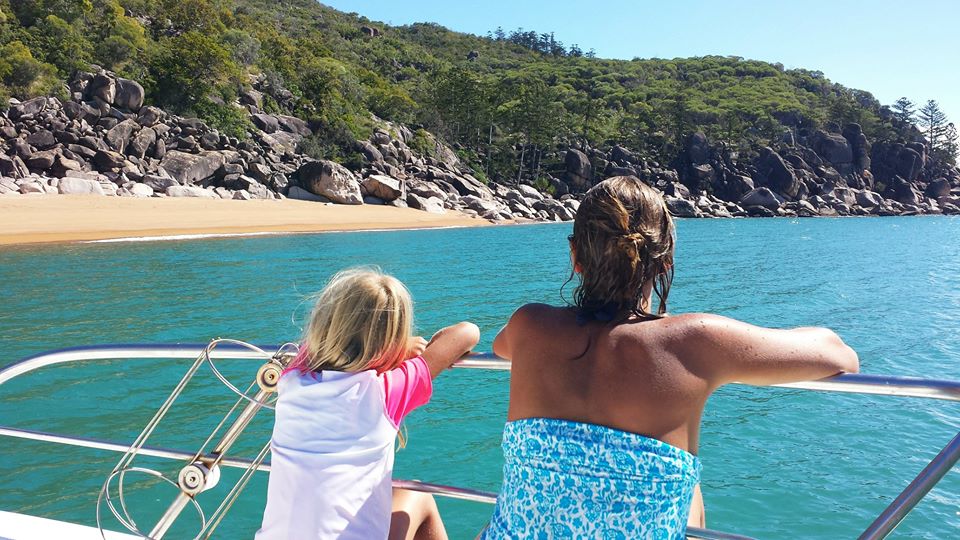 woman and girl looking at view from boat