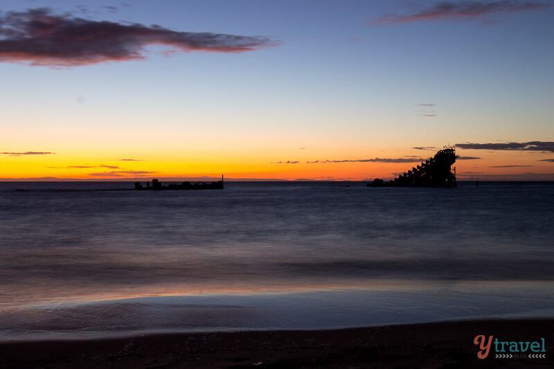 A sunset over a body of water