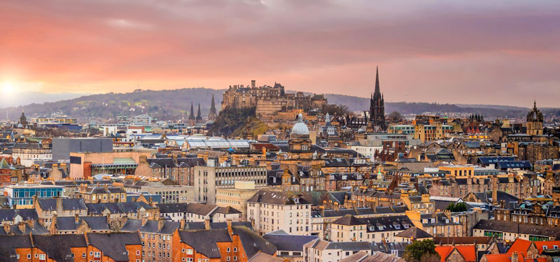 Old town Edinburgh city skyline. Cityscape in Scotland at sunset